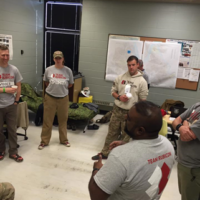 The Team Rubicon Command Post with the initial group of volunteers. As the operation scaled up, the Command Post was reconfigured four times to better suit the increased staffing, planning and workflow. Image Credit: David Korus, Team Rubicon USA